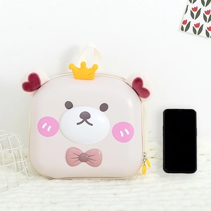 Front detail of cute cartoon bear hardshell toddler backpack with 3D bow and plush ears