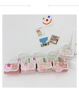 Macro detail of sparkly mini bags with pearl handles and cute fairy doll ornaments