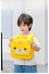 Detail of yellow toddler backpack with cute tiger face and ergonomic wide straps