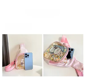Detail view of pink rabbit crossbody bag showing internal capacity for phone and lipstick