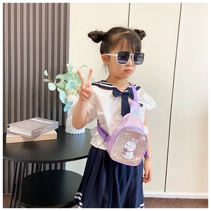 Little girl wearing purple glitter bunny crossbody chest bag with adjustable strap