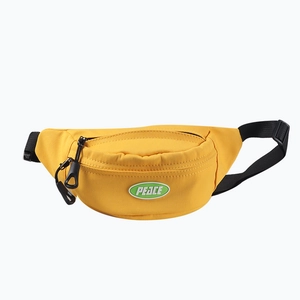 Yellow canvas kids chest bag with PEACE logo and adjustable black strap for children
