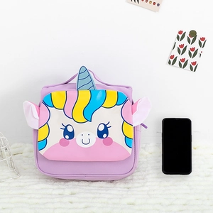 Unicorn kids backpack in light purple with rainbow hair and 3D horn detail on a rug