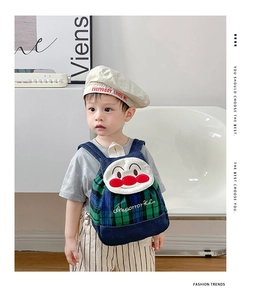 Detail of plaid denim toddler backpack with cartoon face applique and adjustable straps