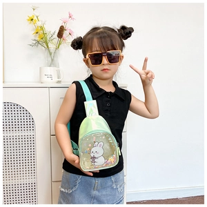 Close-up of girls laser green bunny crossbody bag with colorful flowing sequins detail