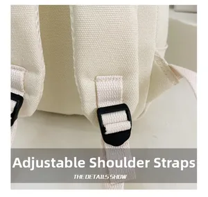 Détail des bretelles réglables avec boucle en plastique noir sur le sac à dos enfant