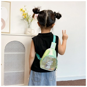 Little girl wearing a green laser PU crossbody bag with quicksand sequin rabbit detail