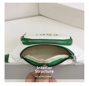 Dettaglio della borsa a tracolla per bambini con fodera interna verde e cerniera robusta