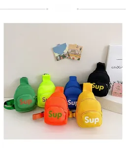 Detailed flat lay of nylon children's mini chest bags in six vibrant neon colors