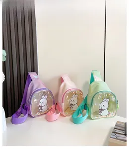 Close-up of glitter sequins and cute bunny graphics on holographic kids' chest bags