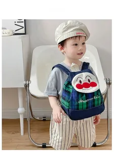 Toddler cartoon backpack featuring patchwork denim and green plaid with embroidery