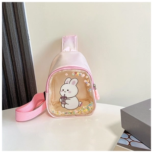 Macro detail of pink glitter crossbody bag with clear window and cute cartoon rabbit print