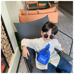 Close-up of blue nylon kids chest bag with Trend print and adjustable buckle strap