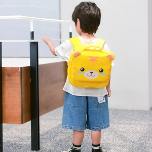 Cute yellow tiger toddler backpack for kids 3-6 years shown on a child outdoors