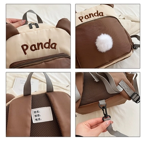 Detailansicht des Panda-Rucksacks mit Namensschild und atmungsaktivem Mesh-Rückenteil