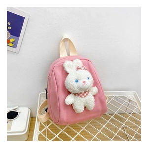 Detail of pink canvas toddler backpack with 3D plush rabbit and plaid scarf decoration