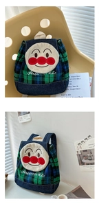 Detail of cartoon plush patch embroidery on checkered canvas toddler backpack for kids