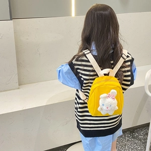 Kids cute yellow canvas backpack featuring a plush rabbit doll and adjustable white straps