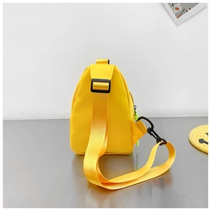 Side view of yellow nylon crossbody bag featuring wide strap and neon zipper detail