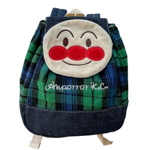Green plaid kids backpack with cartoon character and blue denim base on white background
