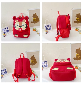 Detail view of red kids tiger backpack with Fu embroidery, side mesh pockets and straps