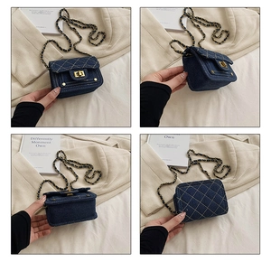 Dettagli della mini borsa a tracolla in denim blu scuro con catena in metallo oro