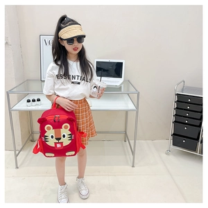 Close-up of red cartoon tiger canvas backpack for kids with functional zipper and handle