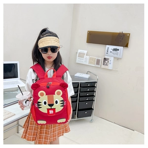Detail view of red toddler backpack with cartoon tiger and side mesh pocket design