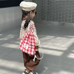 Kids red checkered canvas drawstring backpack with white rope straps for daily casual use