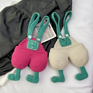 Handmade crochet overall phone bags in pink and cream with cute green accents