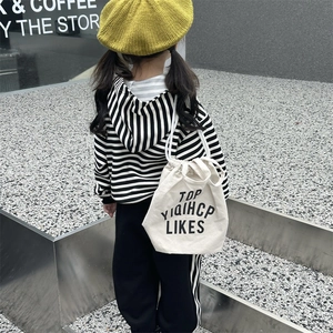 Toddler plaid canvas drawstring backpack shown with striped hoodie and knit beret set