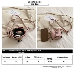 Detailed size chart and internal capacity of pink leather mini drawstring bucket bag
