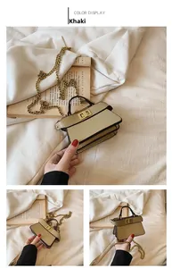 Dettaglio mini borsa quadrata kaki con chiusura a scatto dorata e tracolla a catena