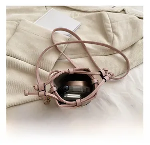 Detail view of the interior capacity of this pink leather mini bucket bag for girls