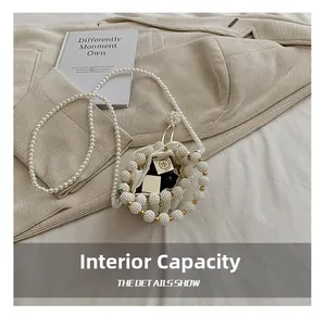 Detailed view of white faux pearl woven mini bucket bag showing internal storage capacity