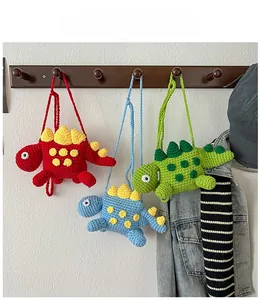 Detailed knit texture of handmade dinosaur crochet bags in red, blue and green colors