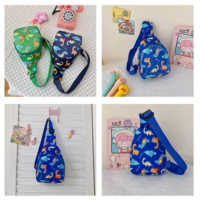 Detail view of cartoon dinosaur chest bags in green and blue with adjustable straps