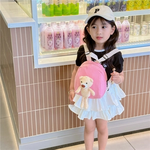 Toddler pink canvas backpack featuring a cute beige plush teddy bear and adjustable straps