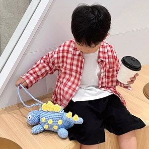Handmade knitted dinosaur crossbody bag for kids in blue cotton yarn with shoulder strap