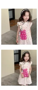Pink handmade beaded crossbody bag for girls featuring a cute strawberry charm pendant