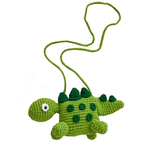 Handmade green crochet dinosaur crossbody bag for kids with long woven shoulder strap