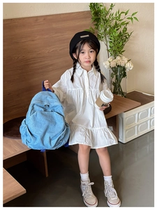 Blue denim kids backpack styled with white dress and black beret for casual school look