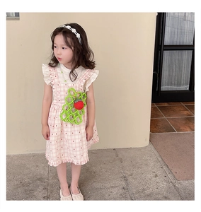 Detail of girls floral pearl headband and handmade strawberry beaded crossbody bag set