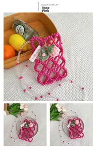 Detail of pink beaded crossbody bag for girls with strawberry crochet charm and strap