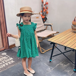 Girl's green polka dot dress with woven pearl bucket bag and straw hat set