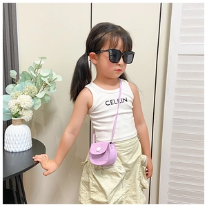 Detail of purple crocodile-patterned mini bag for girls with silver magnetic buckle