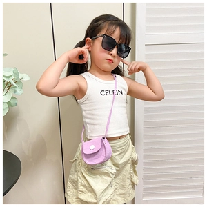 Detail of purple crocodile texture mini saddle bag for girls with white buckle clasp