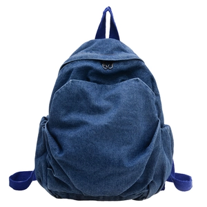 Classic dark blue denim kids backpack with multiple pockets and top handle on white background