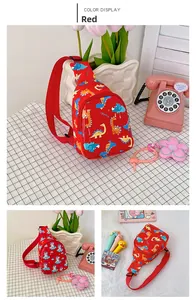 Detail of adjustable red shoulder straps and cartoon dinosaur pattern on kids chest bags