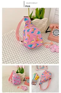 Detailed view of pink kids chest bag featuring cartoon dinosaur and unicorn prints